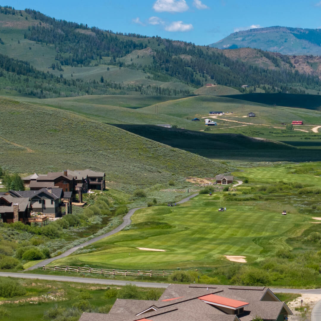 Grand Elk Golf Club with homes and mountains in background