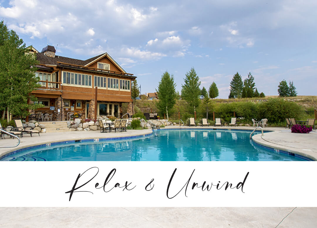 view of pool, building and banner saying Relax & Unwind from Avid Golfer ad